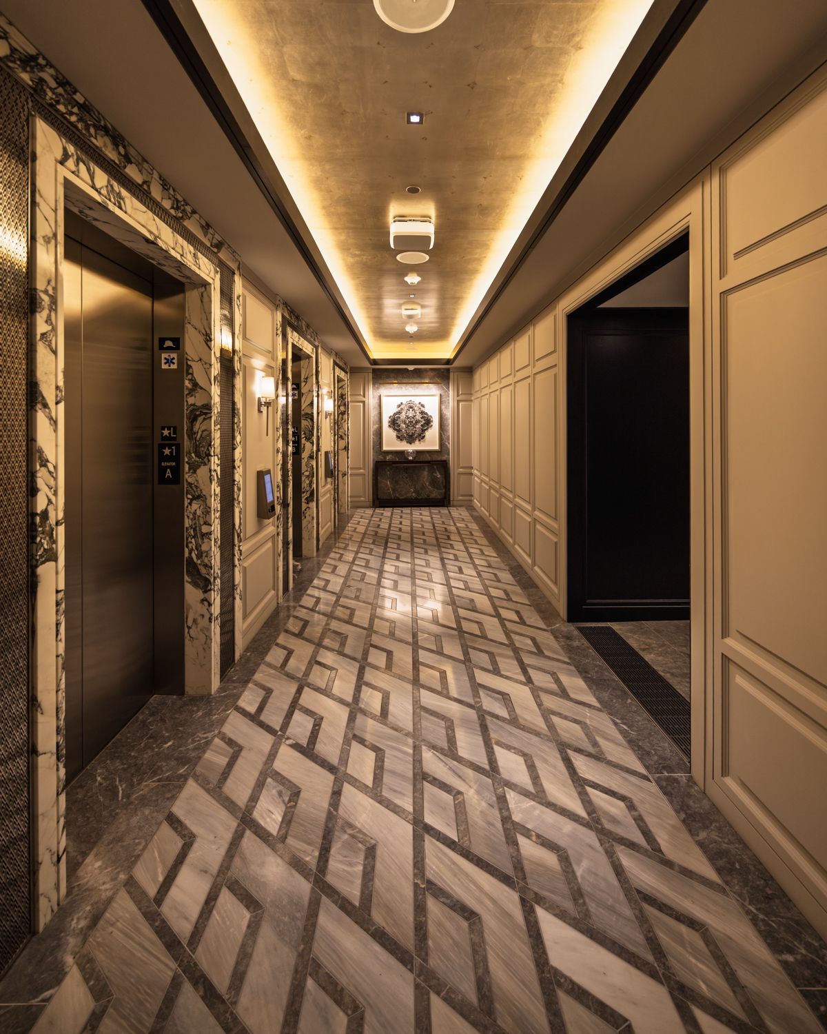 Residential elevator lobby with paneled walls at 706 Mission